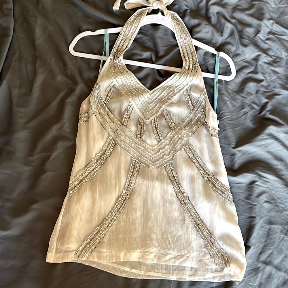 Cream color halter top, with silver sequenced beading.